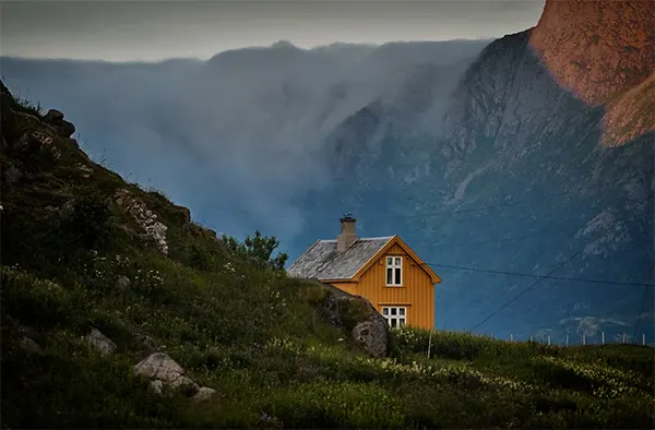 Tiny House Among Mountains