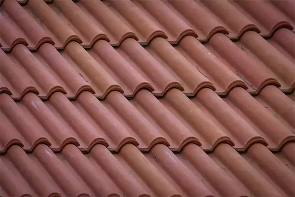 Metal shingle roof tiles designed to resemble traditional clay tiles