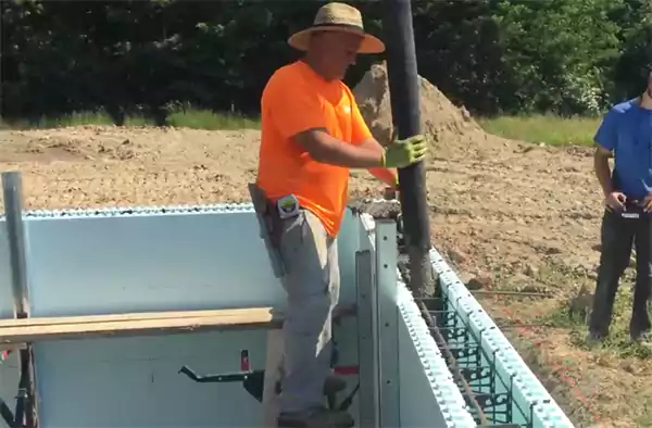Pouring concrete into forms with the help of the concrete pump