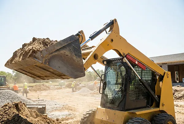construction-loader-lifting-dirt-at-work-site.