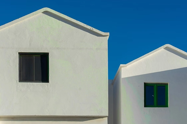 two houses with stucco finishing