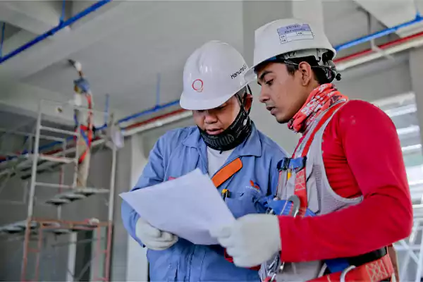 Contractors Discussing Construction Plans in USA