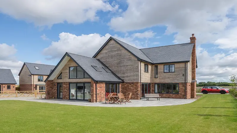 d-Sloped Roof Homes Crossword Clue